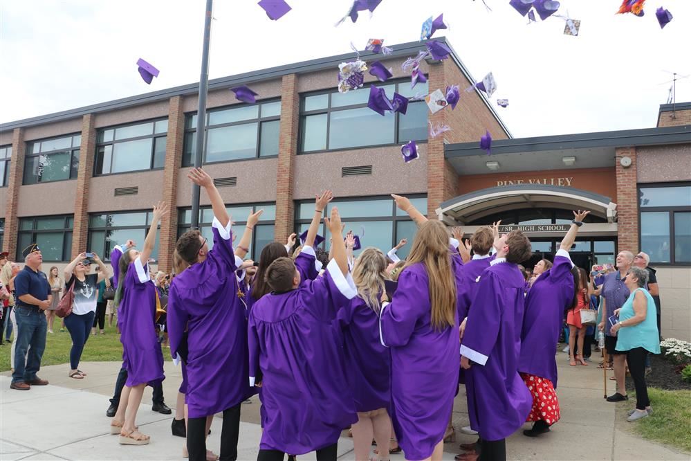  Pine Valley Students flip their caps in the air. 