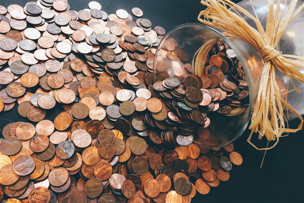 coins falling out of a jar coins falling out of a jar